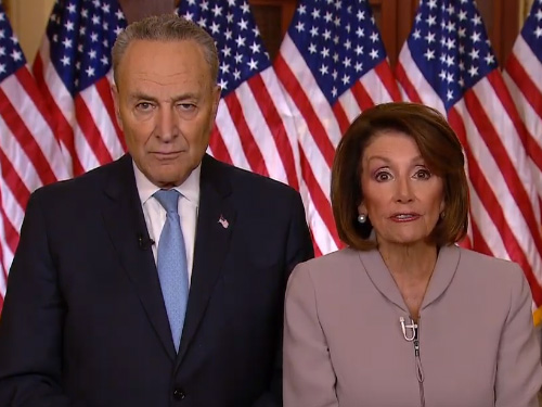 Pelosi and Schumer at a Podium