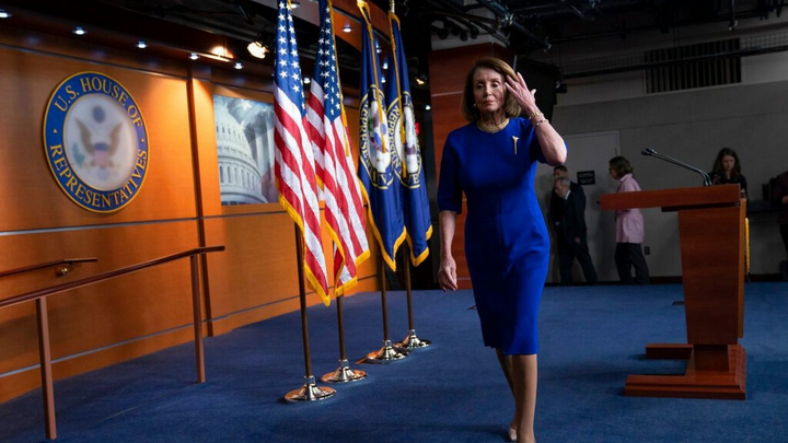 Pelosi leaving the Podium