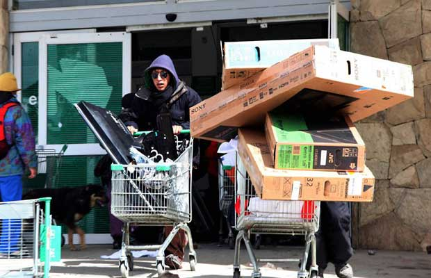 Protesters looting TVs.
